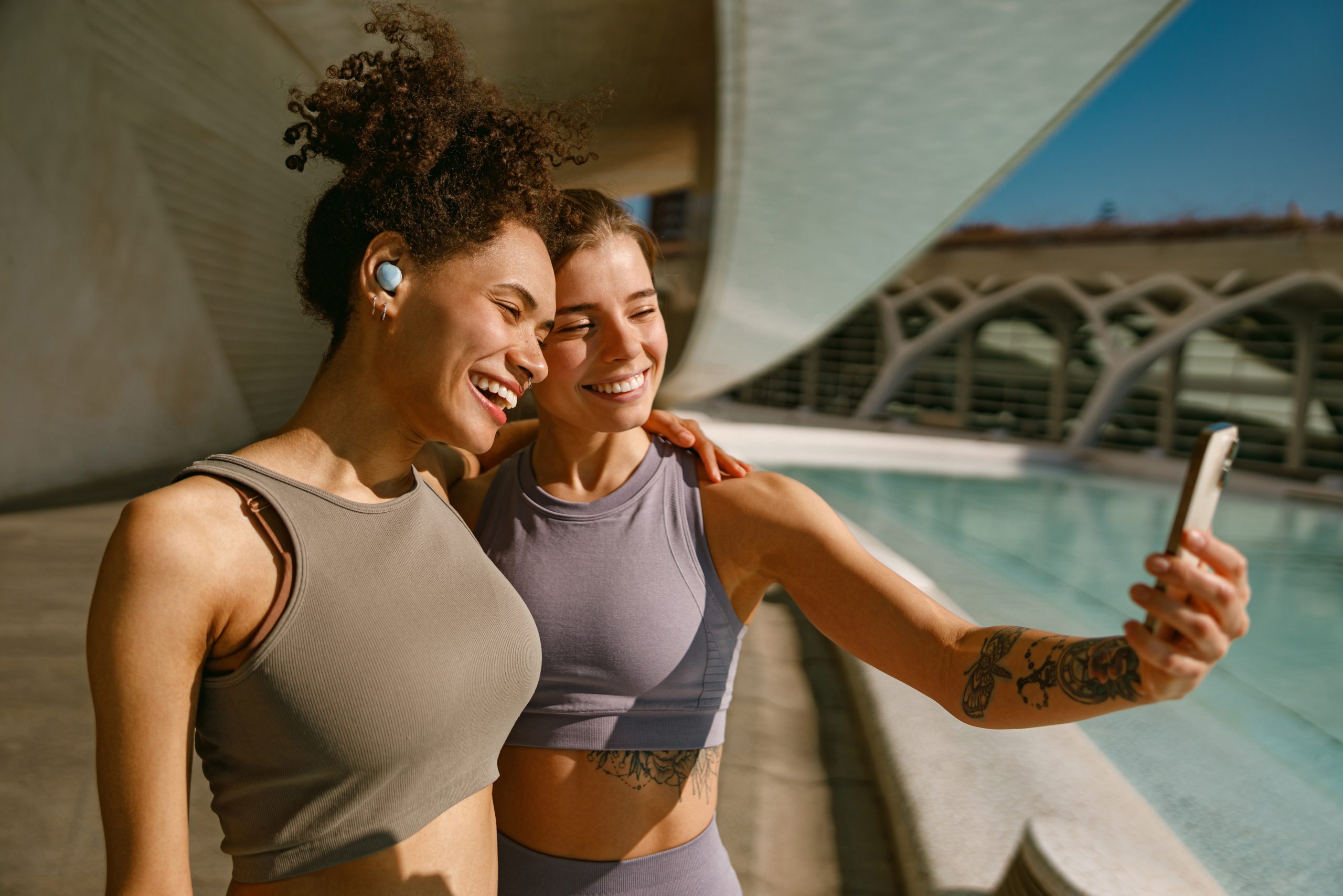 Two friends embracing outdoors after a morning run